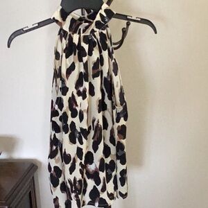 Leopard print sleeveless halter blouse.